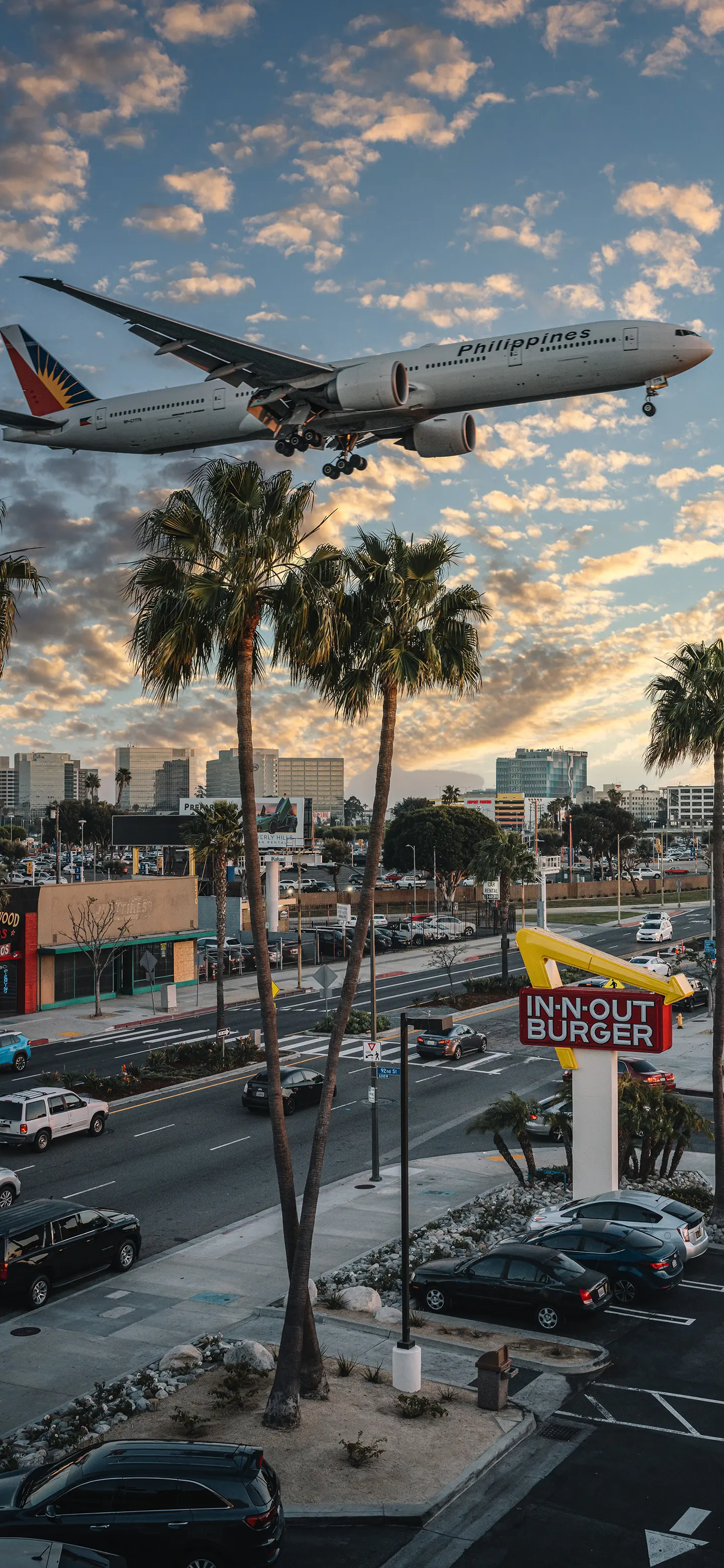 飞机降落城市晚霞壁纸 1440×3120 预览图