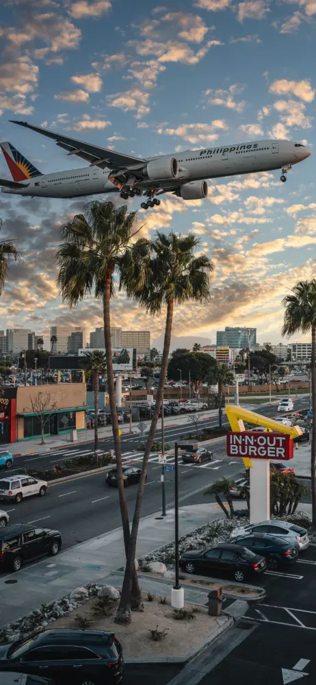 飞机降落城市晚霞壁纸 1440×3120